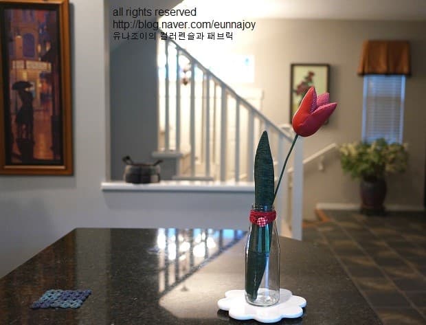 Photo of red flower in cozy home